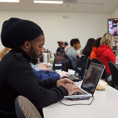 Student in classroom on laptop