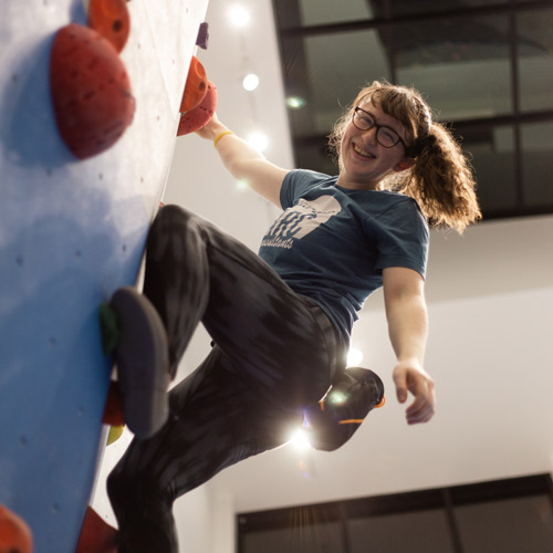 person climbing on the wall