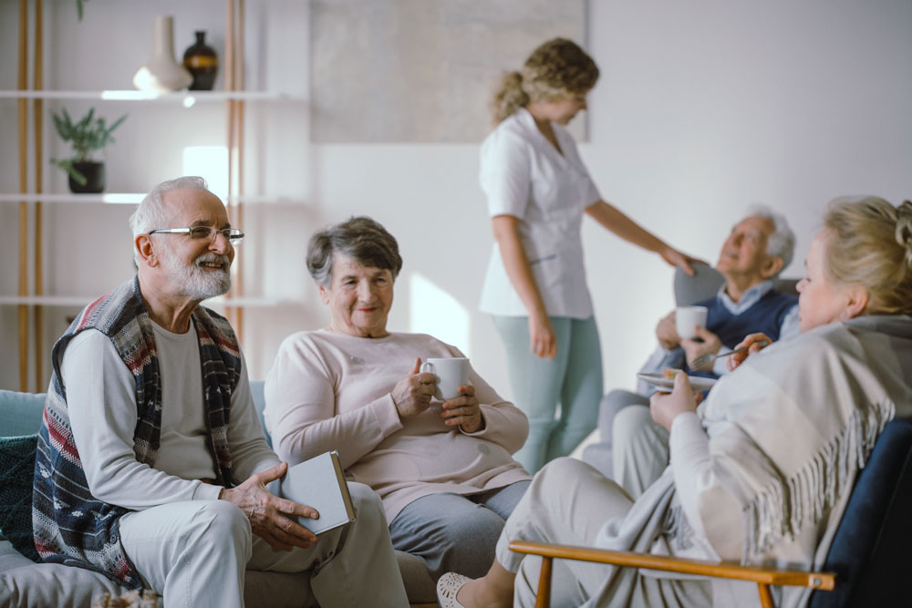 Older adults sitting in a circle talking