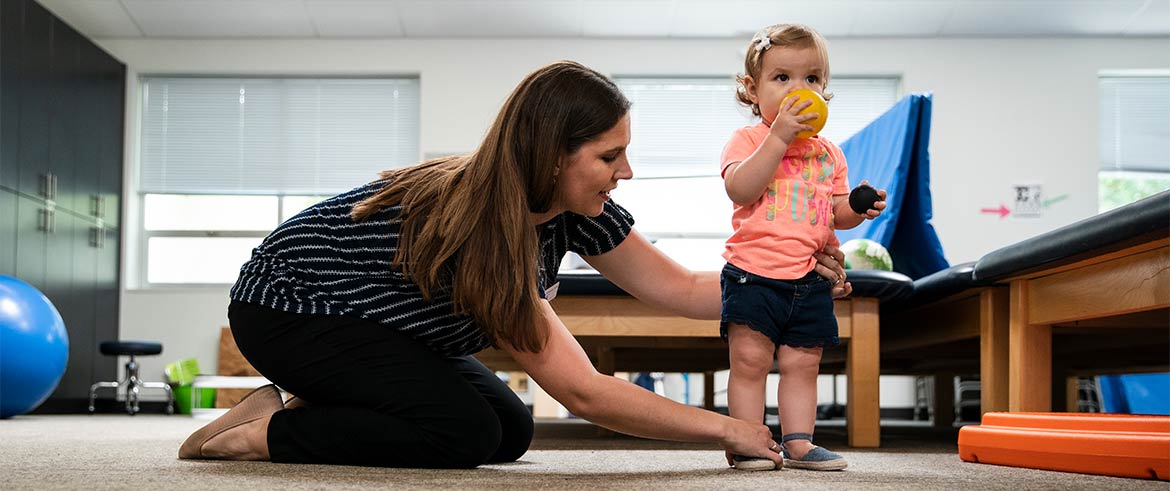 Physical therapist helping patient